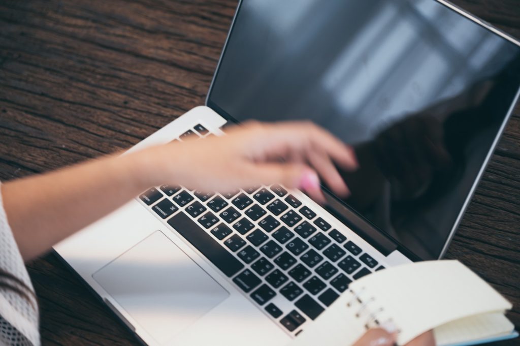 Work from home concept, Hands of Asian young woman work with laptop notebook